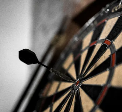 darts board with dart in bullseye